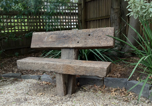 Solid rustic sleeper garden seat made from recycled railway sleepers